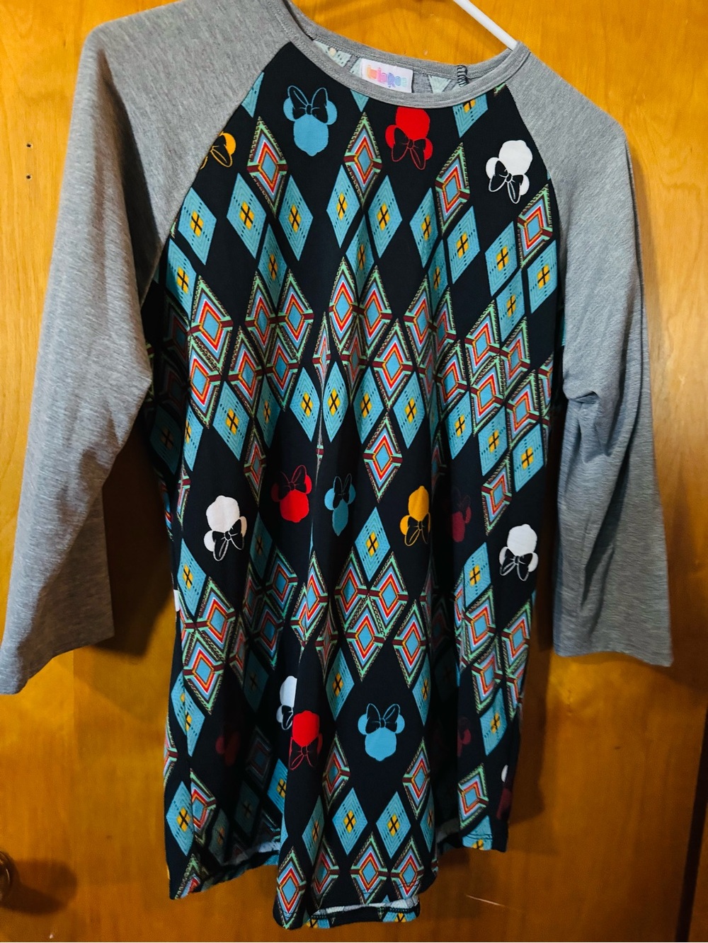 LuLaRoe Black Raglan Top with Gray Sleeves and Multicolor Diamond & Bow Motif